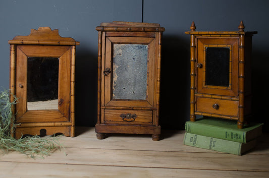 Antique French bamboo medicine cupboard sold individually with original mirror glass.