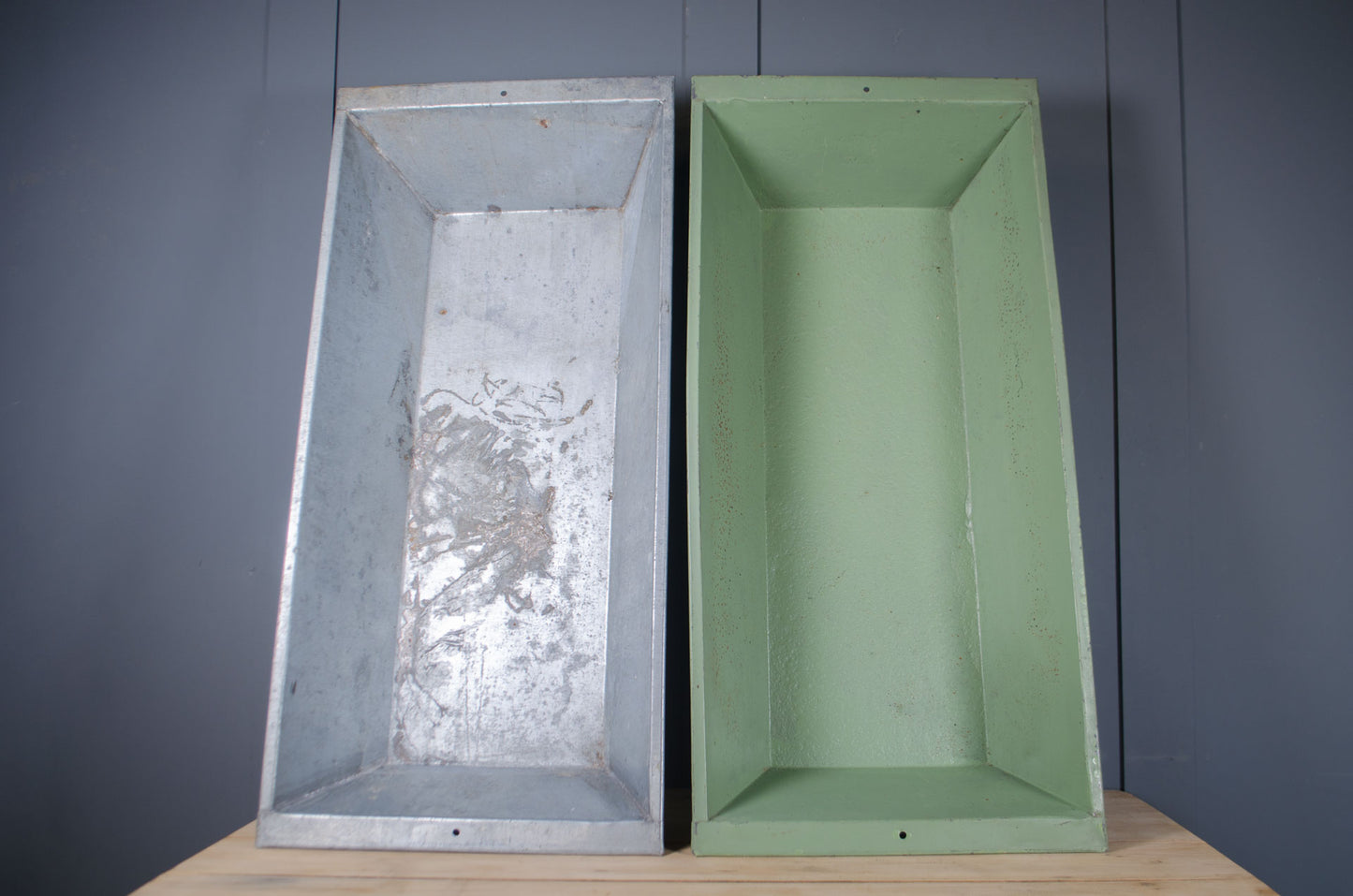 Slim rectangular metal planter with aged galvanised finish.