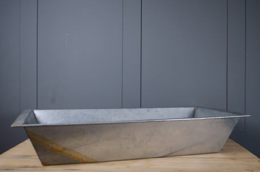 Rustic galvanised metal trough for patio and garden displays.