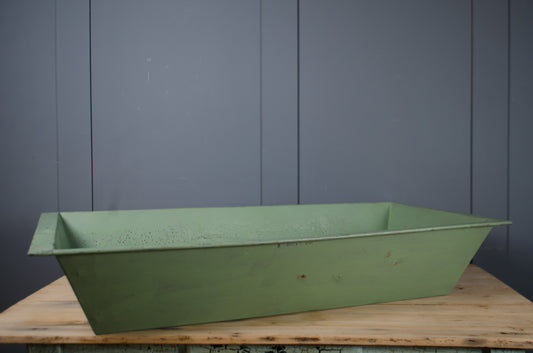 Vintage metal planting trough with weathered surface patina.