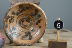 slip glazed terracotta bowl on rustic table