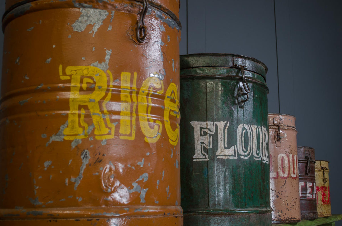 
Reclaimed Indian metal storage bins with painted lettering
