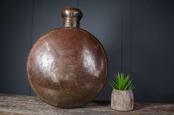 antique Indian water carrier bottle

vintage Indian vessel décor

brass welded water pot

rustic Indian home décor

antique decorative bottle

Indian sideboard décor

polished antique water carrier

large Indian display vessel
