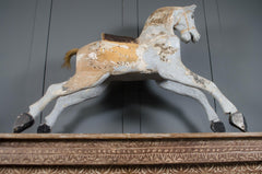 Antique Victorian rocking horse with distressed finish and original base