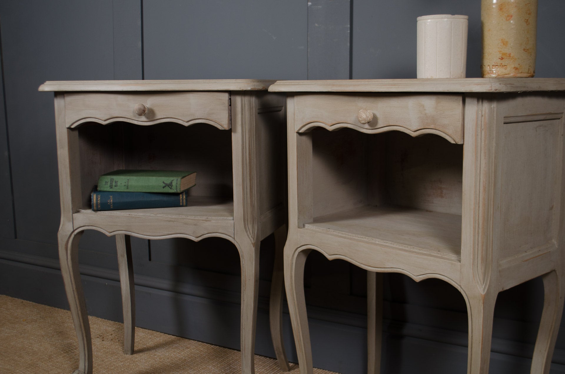 
Louis XV style painted bedside tables with worn grey patina