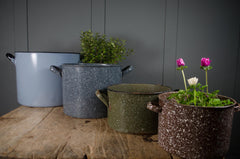 Assorted vintage enamel buckets with double handles.
