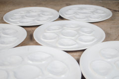 Vintage French white glazed oyster plate with six oyster wells and central lemon compartment.
