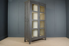 slim antique glazed cupboard