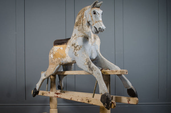 Original Victorian rocking horse with chippy paint on wooden stand