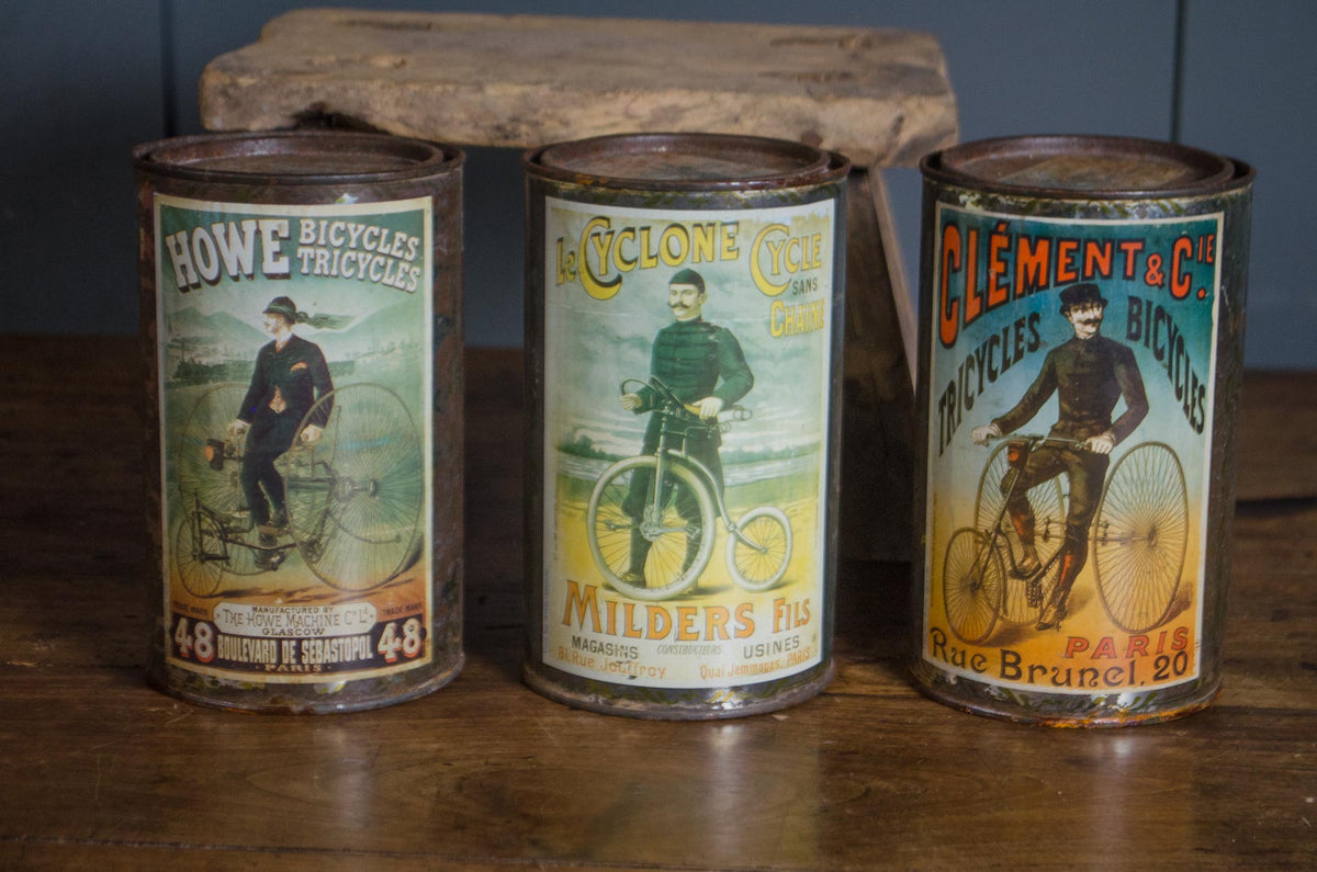 
French biscuit tins with early bicycle advertising