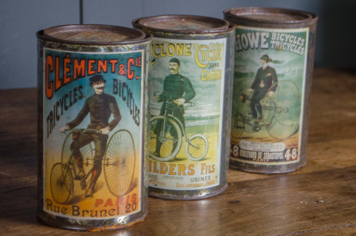 Set of three French vintage bicycle advertising biscuit tins
