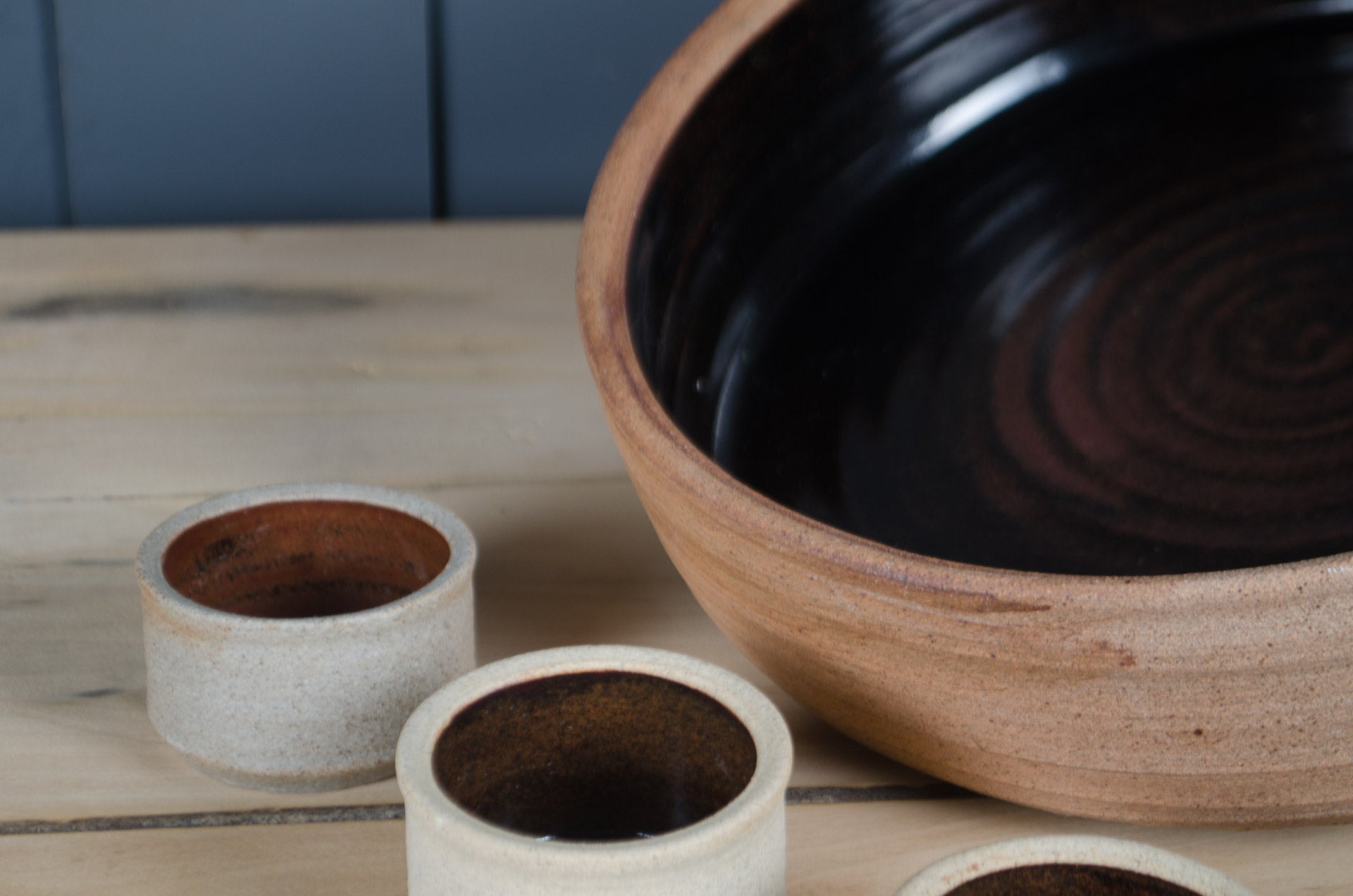 French country style stoneware bowl set with reactive glaze and six versatile ramekin pots.