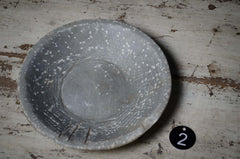 Vintage stone bowl on a rustic wooden table
