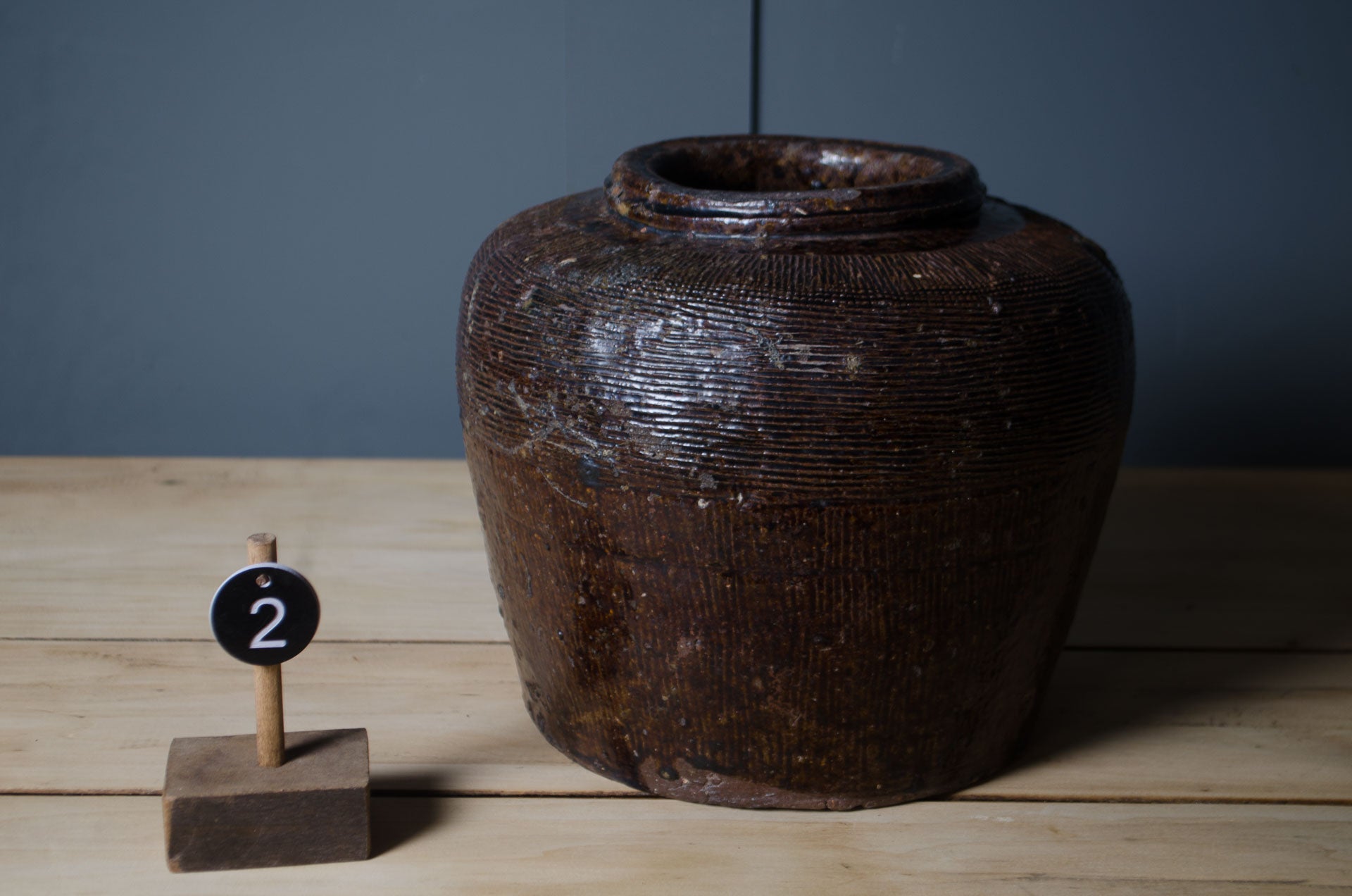 
Traditional antique Chinese storage vessels with weathered glaze and handmade craftsmanship.