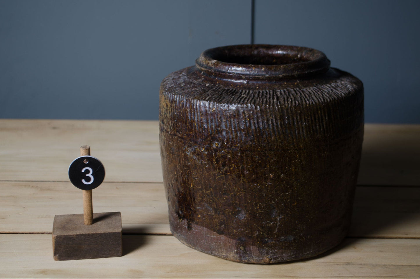 Hand-thrown Chinese preserve jars sold separately with unique rustic stoneware finishes.