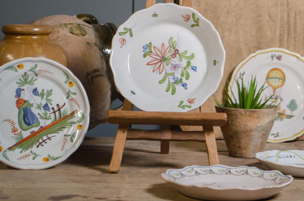 
Collection of hand-painted French Quimper faience plates