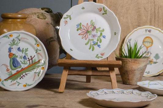 Collection of hand-painted French Quimper faience plates