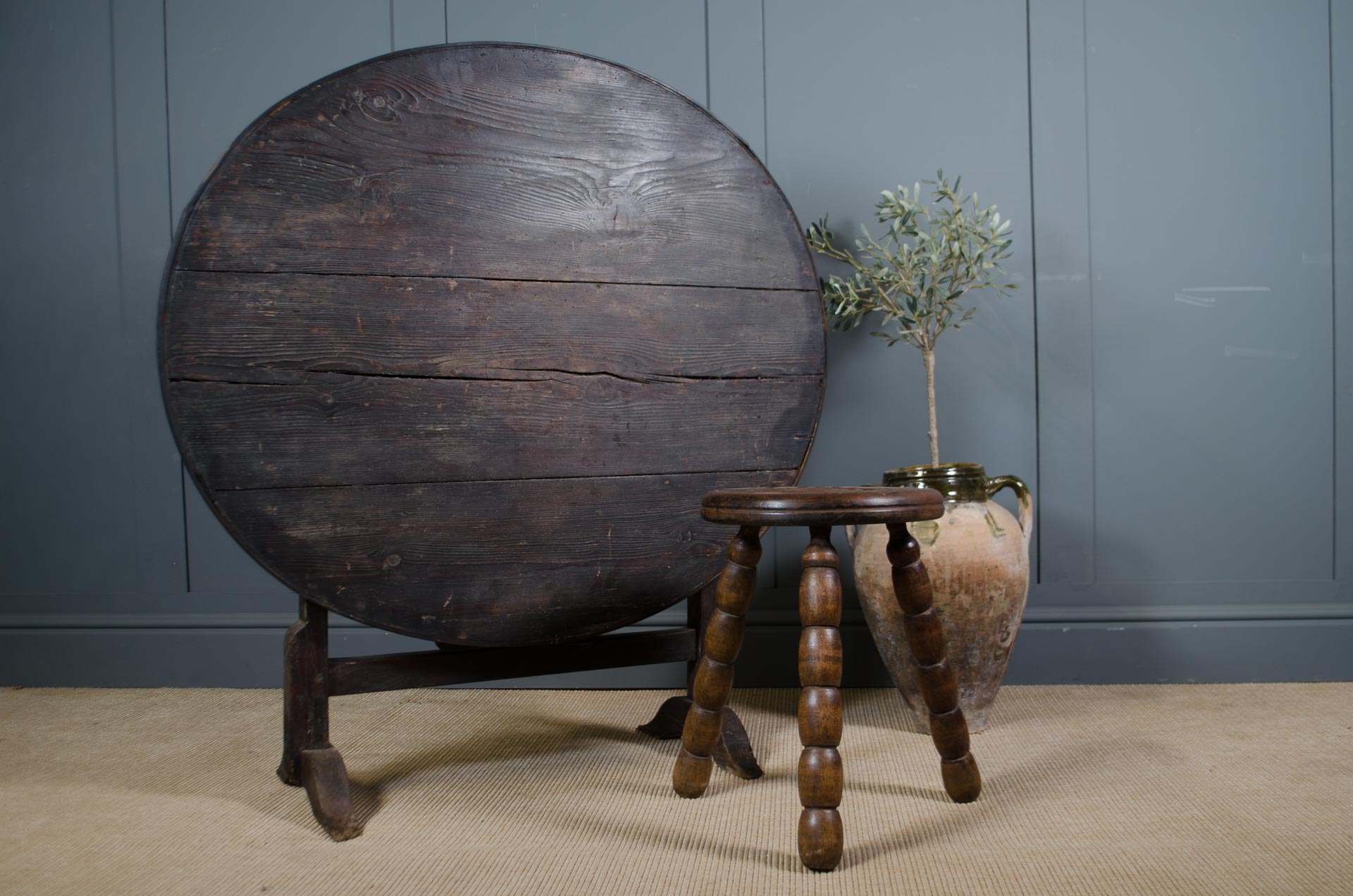 
Antique French vineyard table with round tilt top design