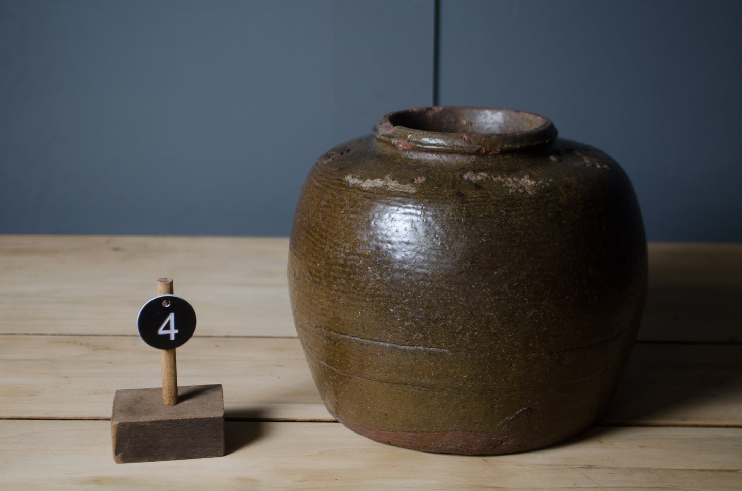 Decorative Chinese preserve jars in rustic stoneware with rich brown glazed surfaces.