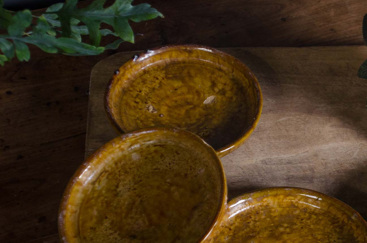
Handmade Moroccan pottery plates in green and ochre