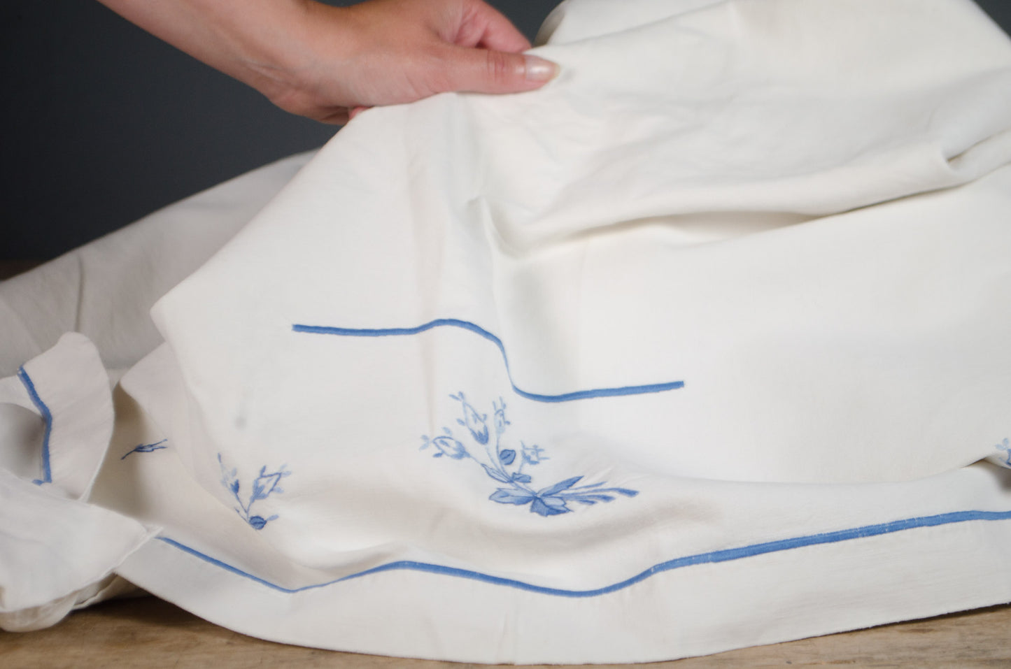 Antique French heavyweight linen tablecloth with blue flower embroidery