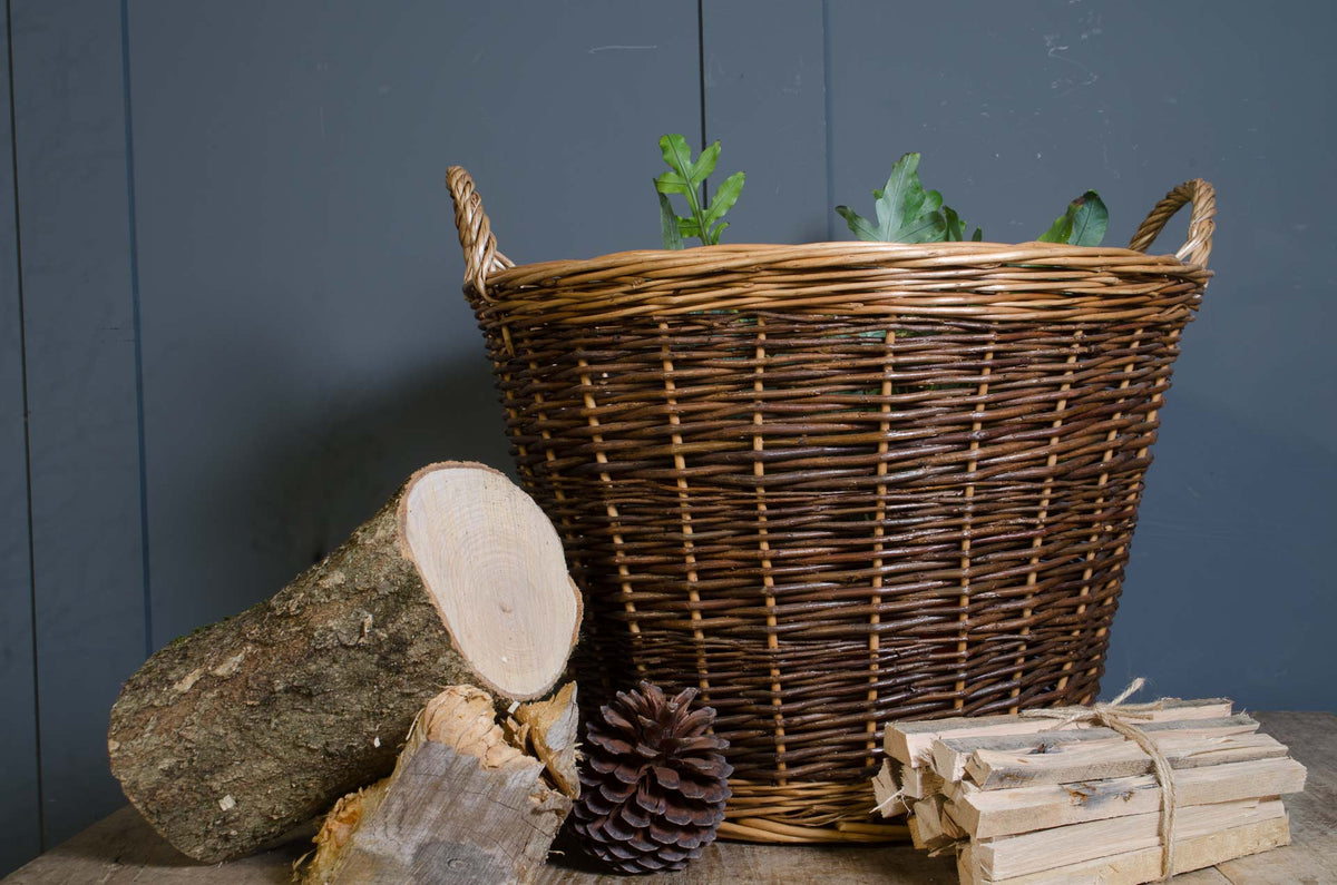 Round wicker log storage basket in natural brown willow