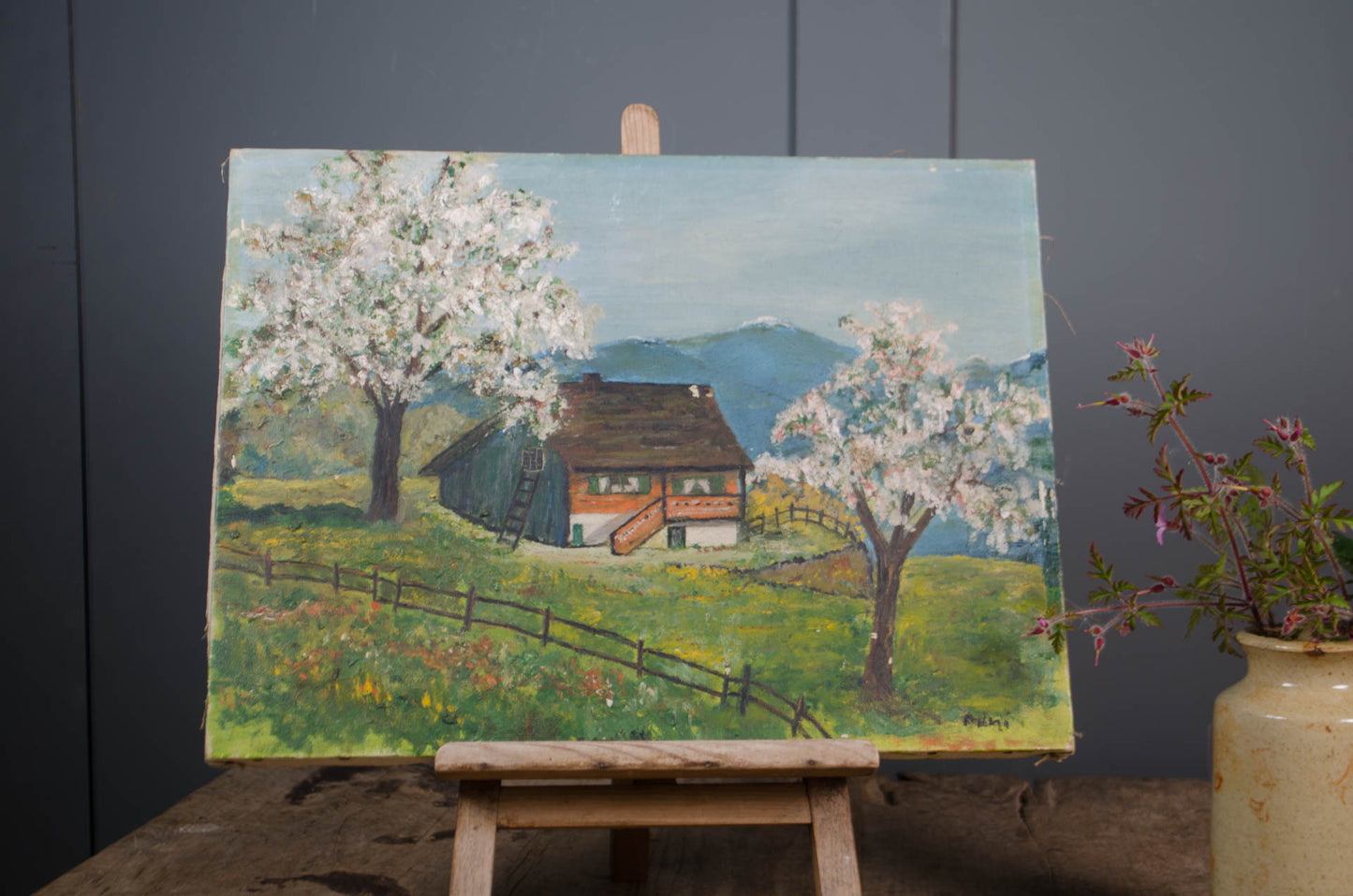 Hand-painted French landscape with rolling hills and flowering trees