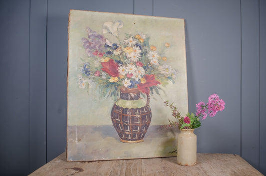 Vintage French flower painting with worn aged canvas finish
