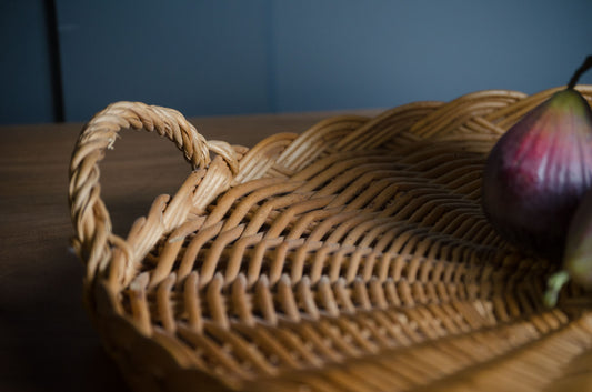 French wicker bread tray used as wall decor