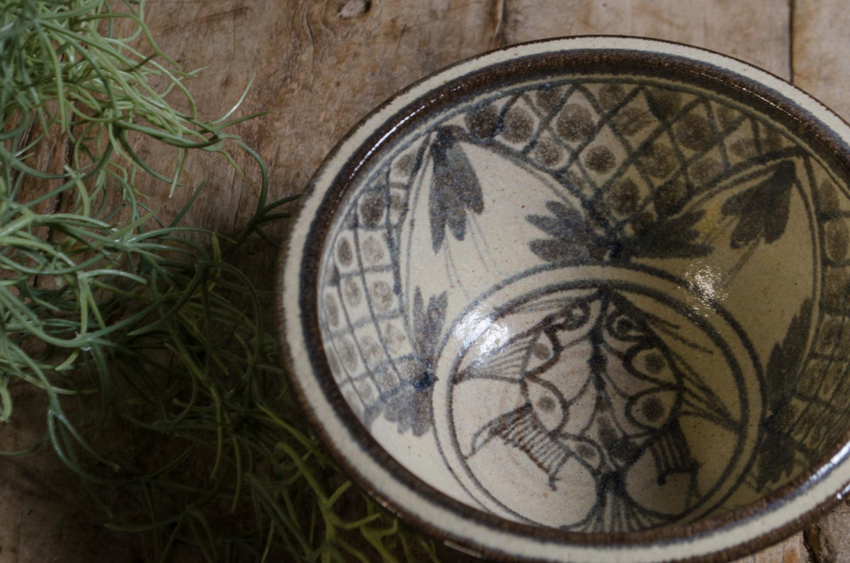 Decorative ceramic fish bowl with painted leaves