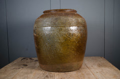 Antique brown glazed Shanxi rice wine jar with decorative geometric banding