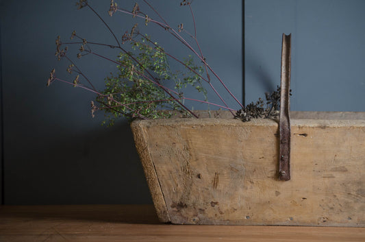 Rustic old wooden garden trug with metal handle
