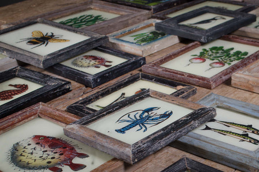 Indian reverse painted glass artwork in reclaimed wooden frame