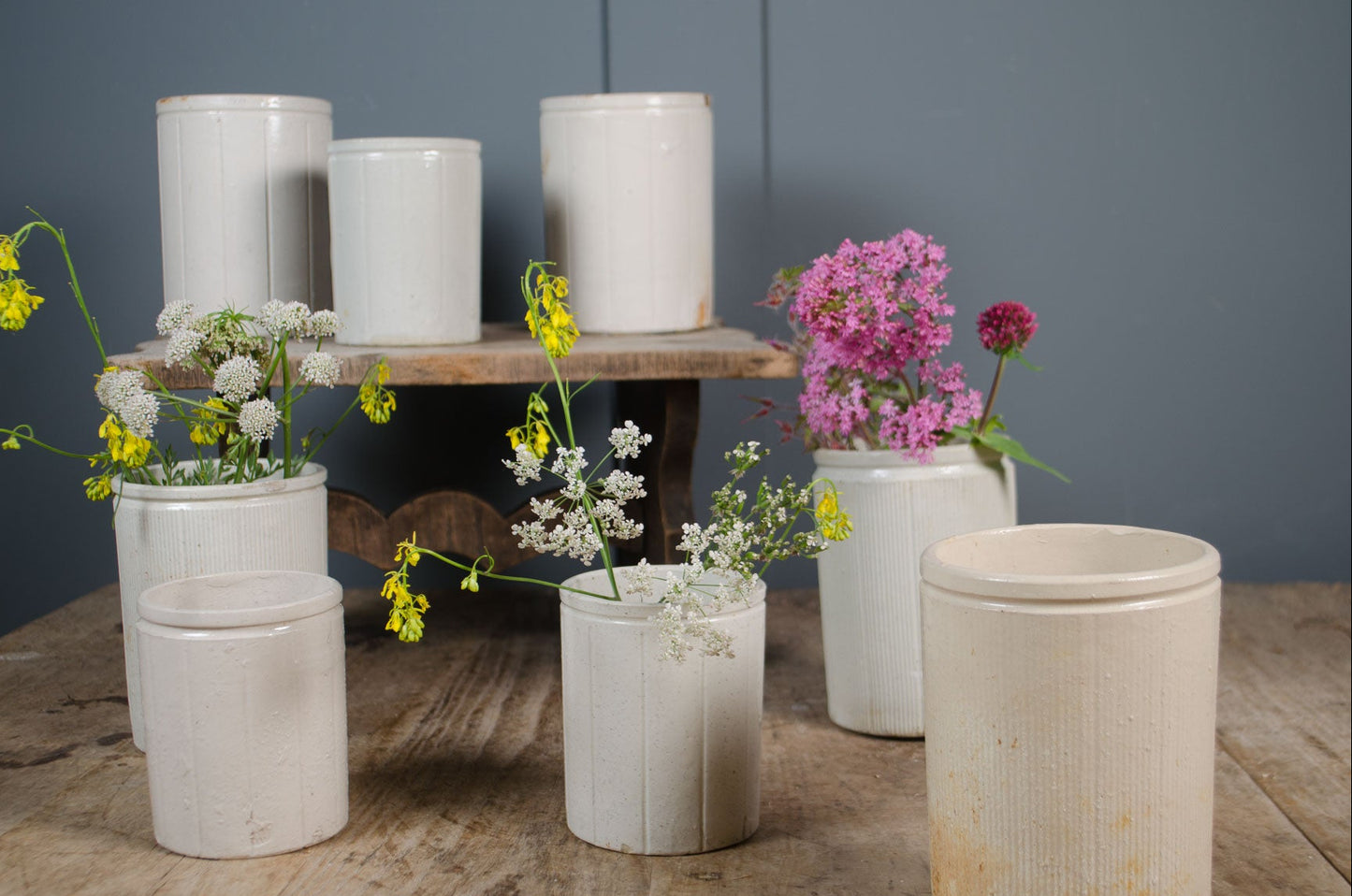 Rustic antique preserve pots with aged cream glaze