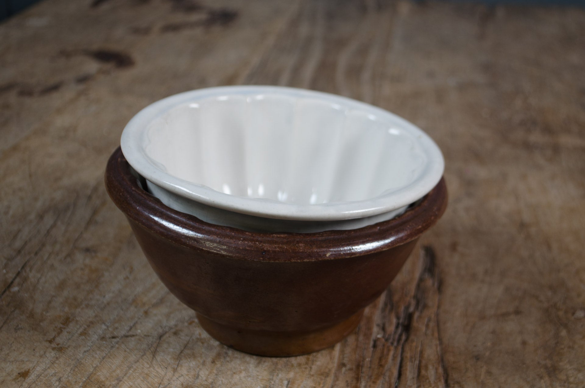 
iron stone bowl Pair of antique ceramic jelly moulds with fluted detail