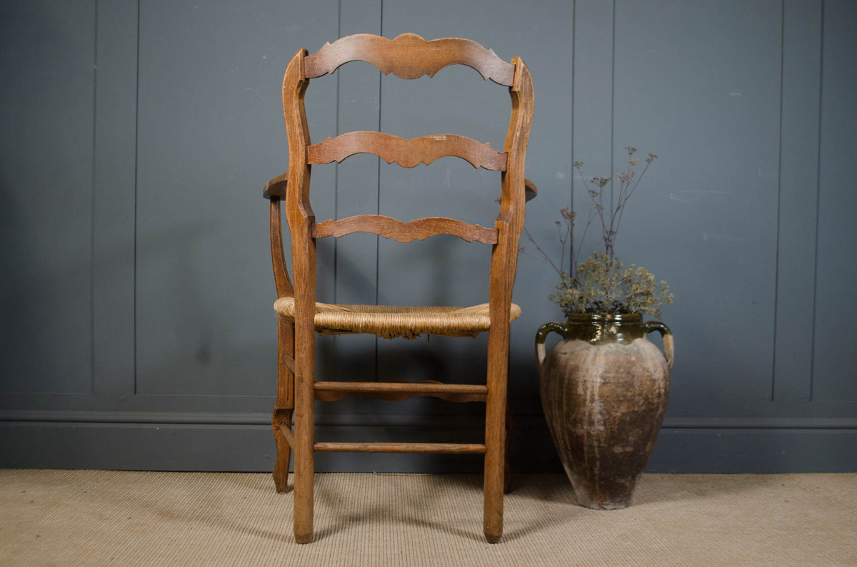 
- French wooden armchair with natural rush seating