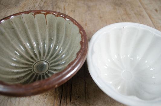 Rustic farmhouse ceramic jelly moulds with aged glaze iron stone