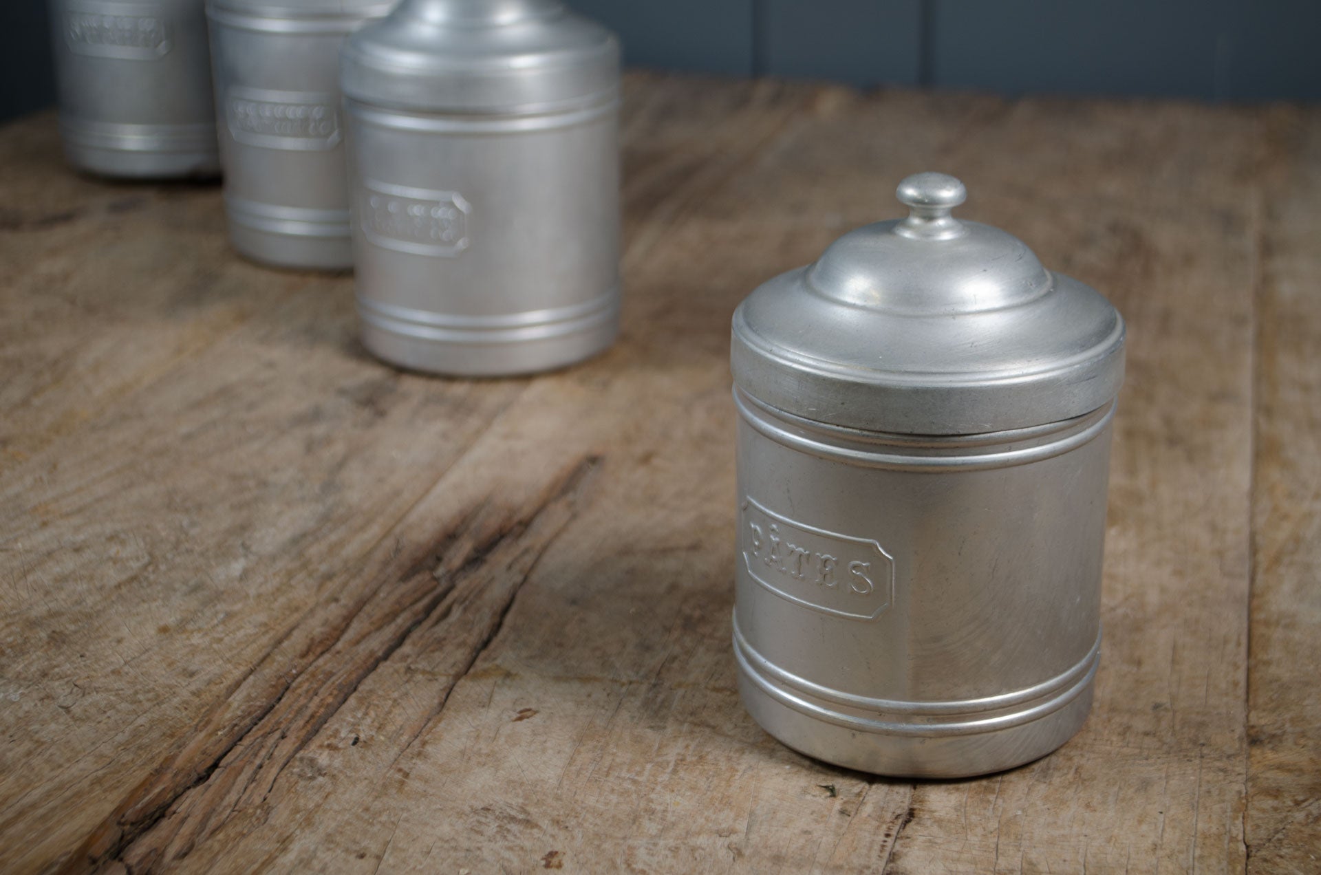 
French stacking kitchen storage tins labelled sugar flour coffee and pasta