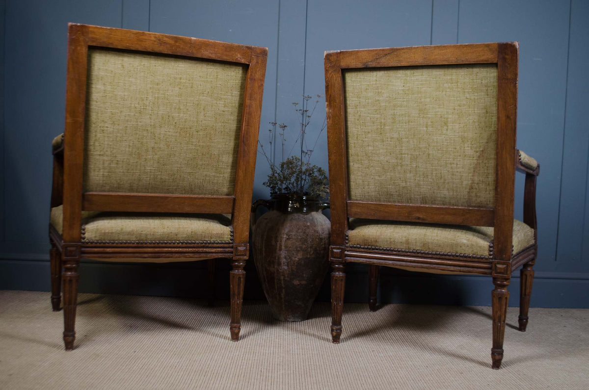 - Antique French parlour chairs with carved wooden frames