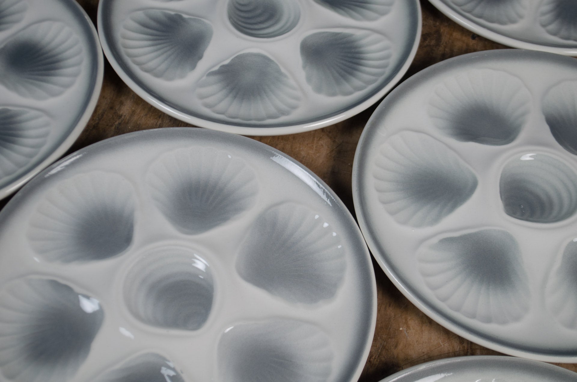 
Pale grey and white ceramic oyster serving plate from France
