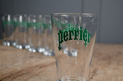 Vintage French Perrier tumblers on wooden table

