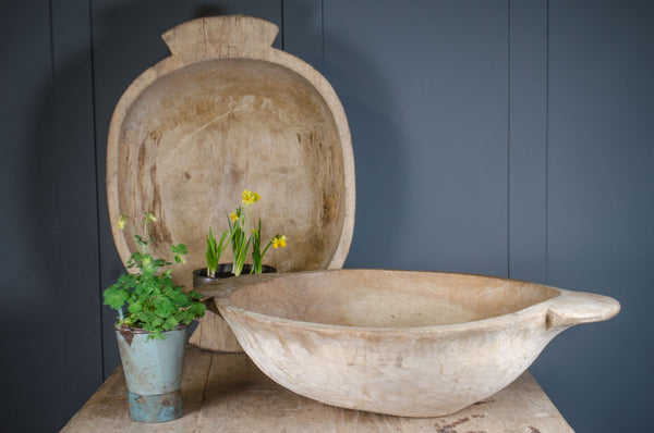Antique Dutch dough bowl hand carved from single piece of wood with pale finish and wide shallow form