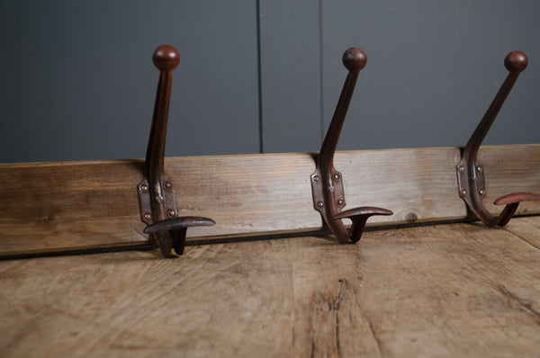 Reclaimed timber coat hooks for hallway storage